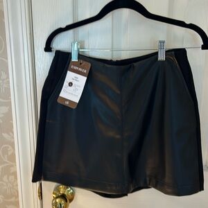 This is a never worn jet squirt. It is a vegan leather front with short/skort
